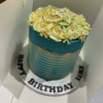 WHITE ROSETTE BLUE OCCASION CAKE