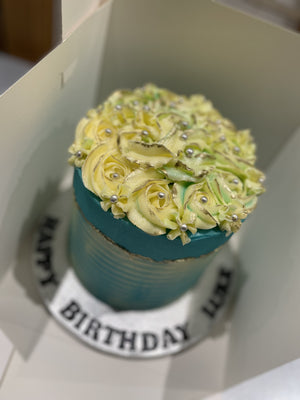 WHITE ROSETTE BLUE OCCASION CAKE