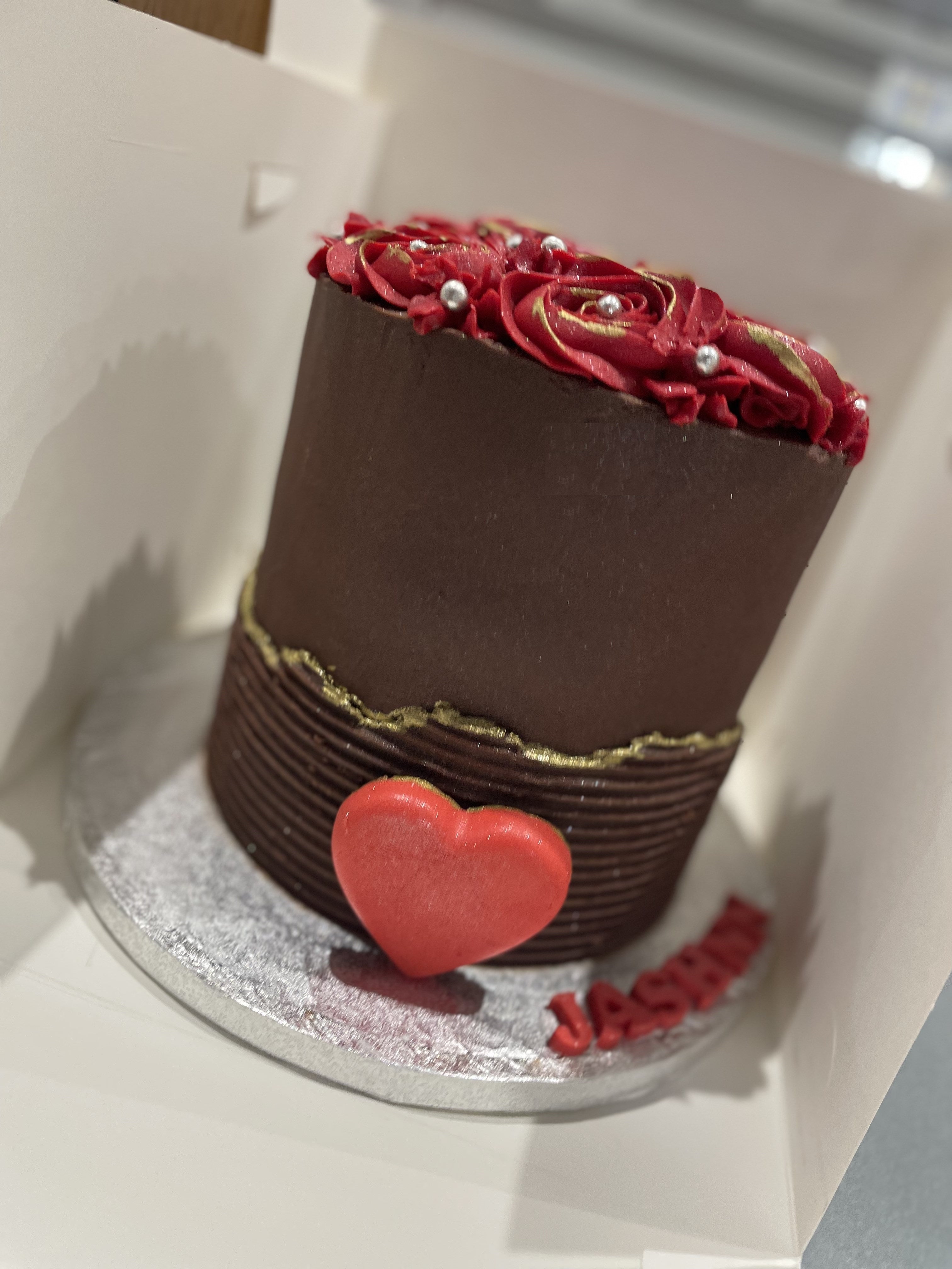 RED ROSETTE HEART OCCASION CAKE