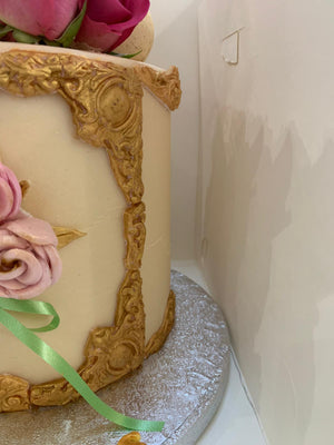 ROSE AND FEATHER GOLD FRAME CAKE