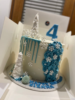 SNOWFLAKE ROSETTE DRIP CAKE