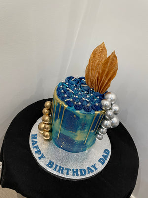 AZURE SAIL GOLD DRIP CAKE
