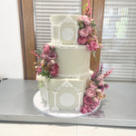 WHITE PILLAR FLORAL WEDDING CAKE