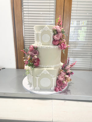 WHITE PILLAR FLORAL WEDDING CAKE