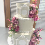 WHITE PILLAR FLORAL WEDDING CAKE
