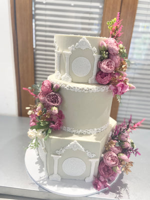 WHITE PILLAR FLORAL WEDDING CAKE