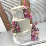 WHITE PILLAR FLORAL WEDDING CAKE