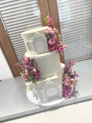 WHITE PILLAR FLORAL WEDDING CAKE
