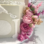 WHITE PILLAR FLORAL WEDDING CAKE