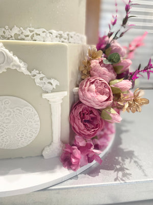 WHITE PILLAR FLORAL WEDDING CAKE