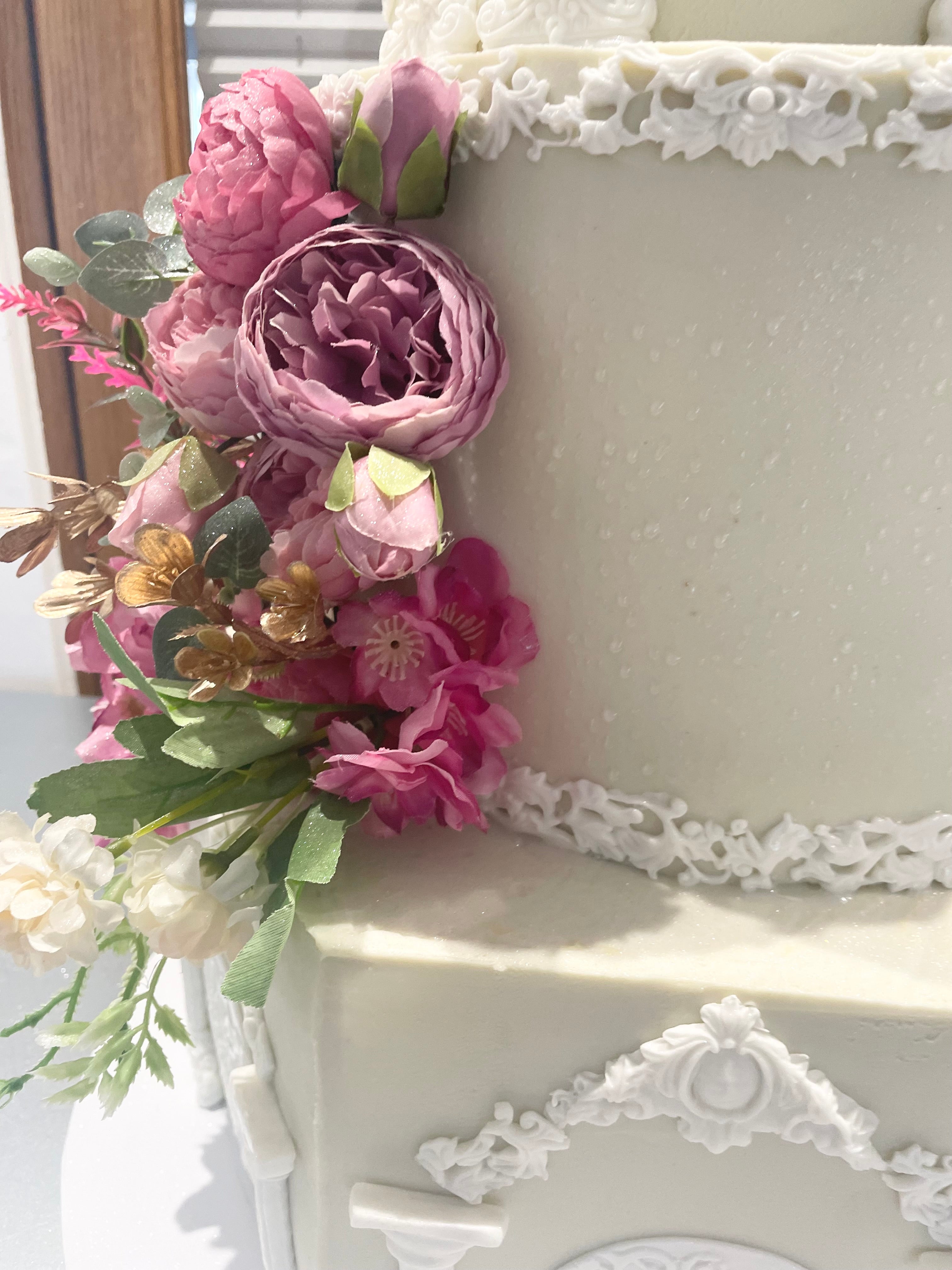 WHITE PILLAR FLORAL WEDDING CAKE