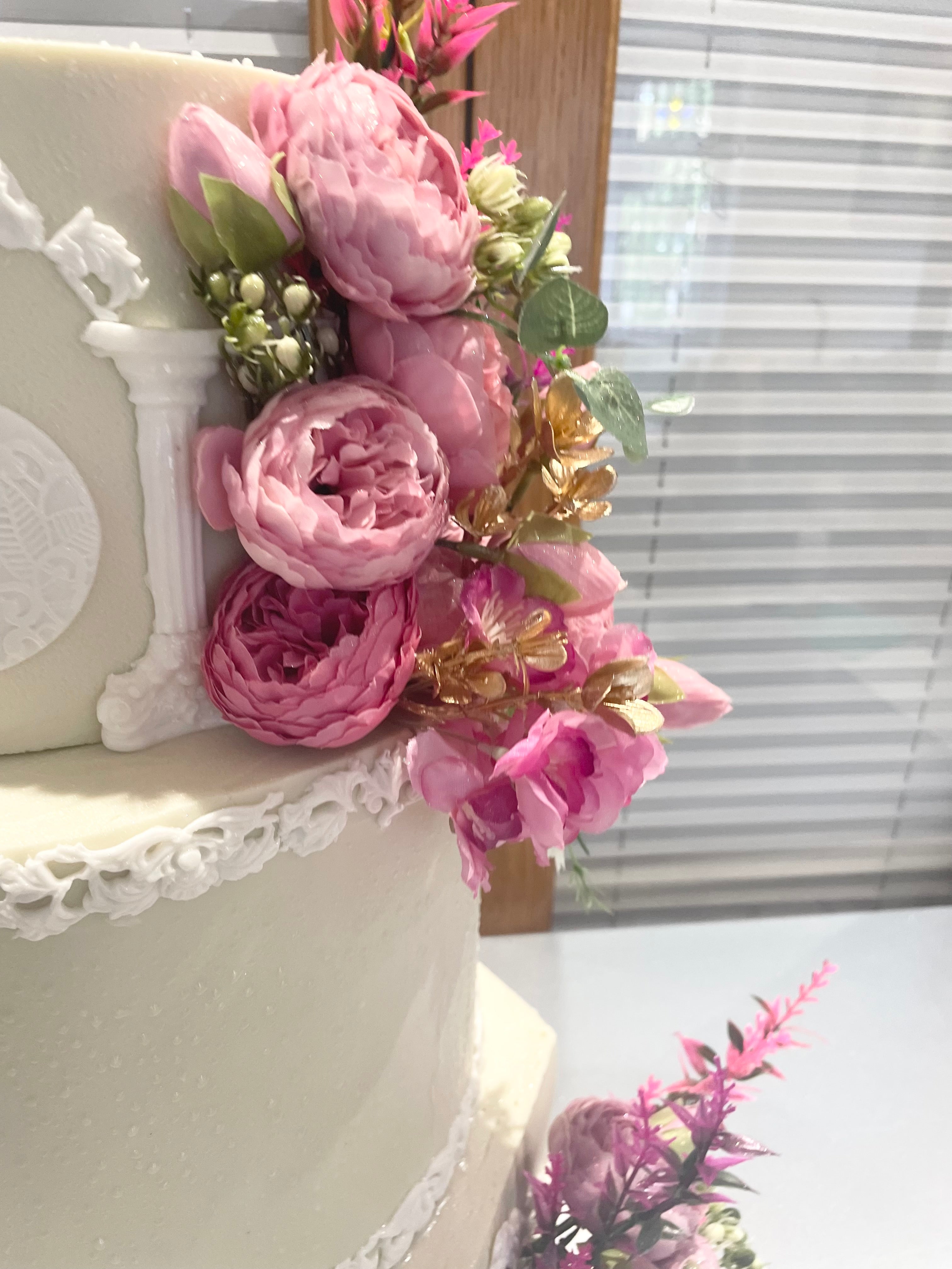 WHITE PILLAR FLORAL WEDDING CAKE