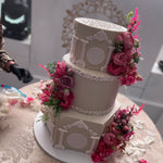 WHITE PILLAR FLORAL WEDDING CAKE