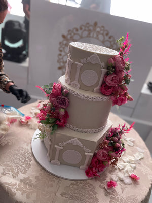 WHITE PILLAR FLORAL WEDDING CAKE