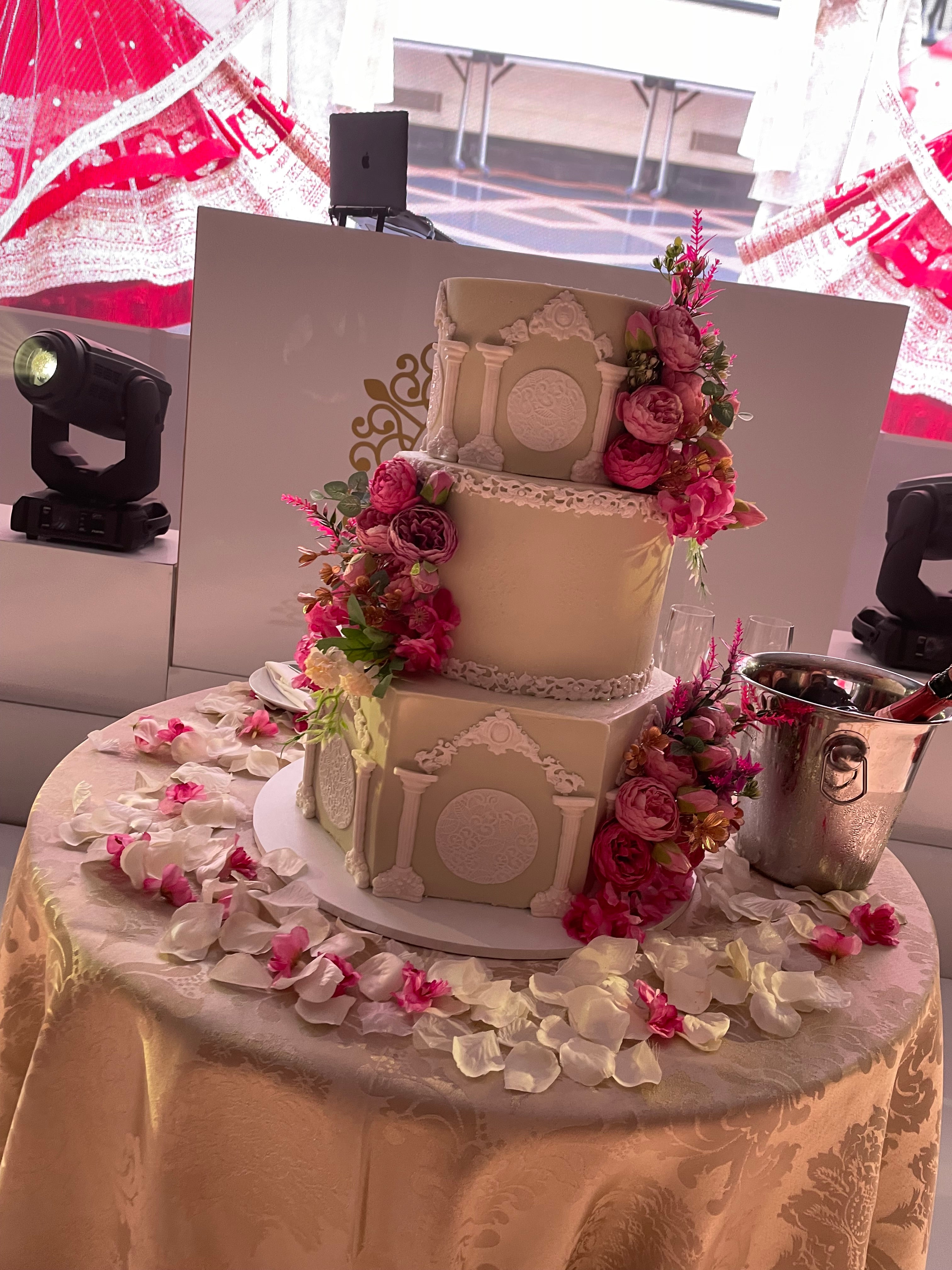 WHITE PILLAR FLORAL WEDDING CAKE