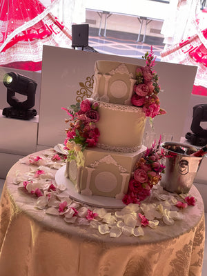 WHITE PILLAR FLORAL WEDDING CAKE