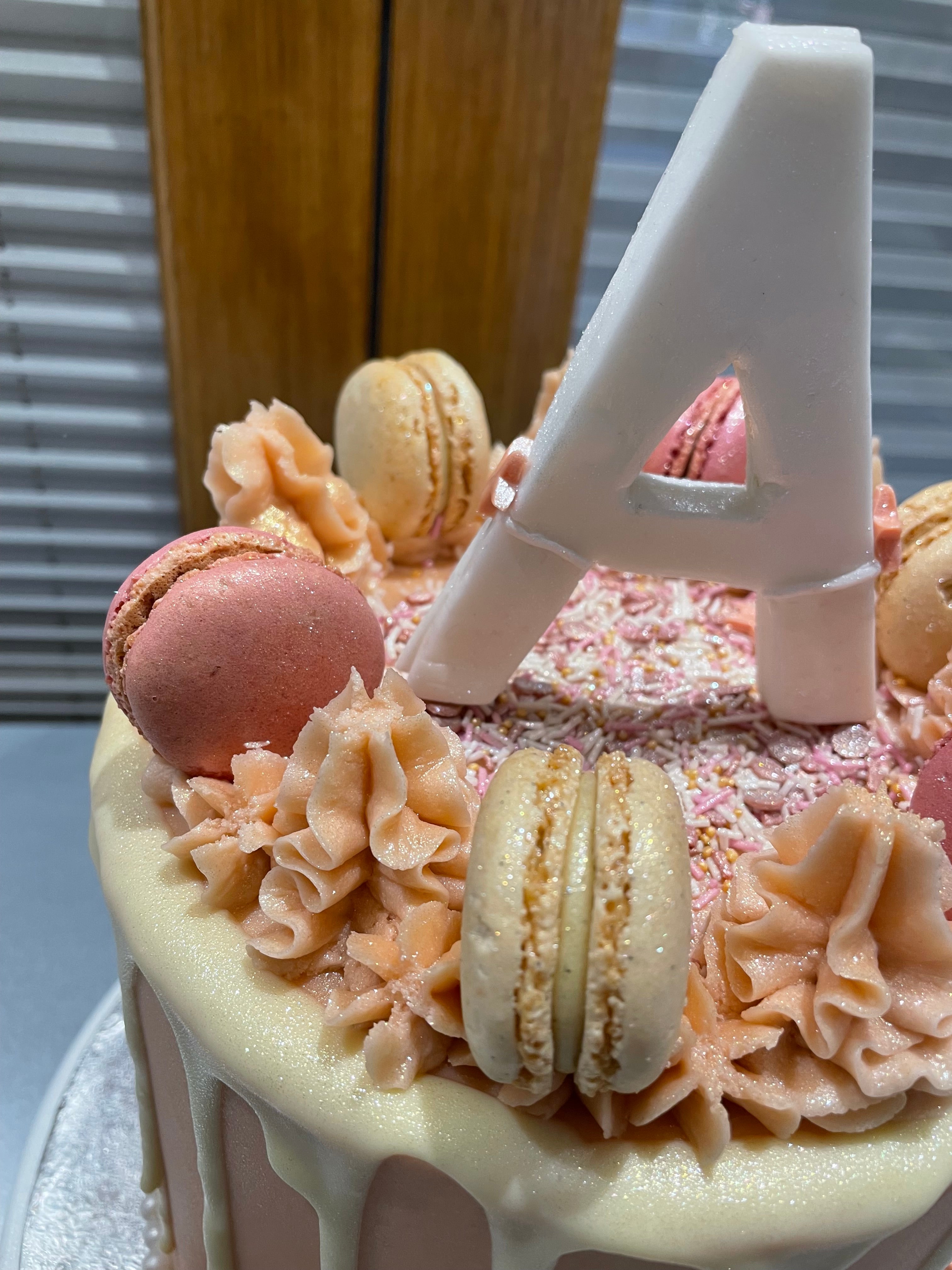 PINK MAC INITIAL OCCASION CAKE