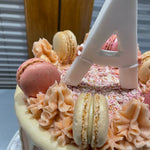 PINK MAC INITIAL OCCASION CAKE