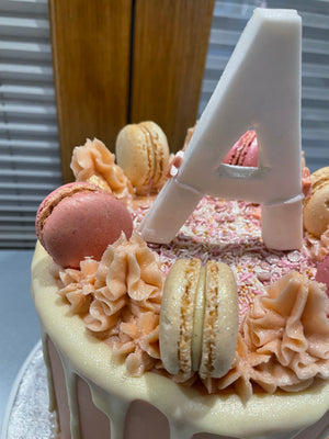 PINK MAC INITIAL OCCASION CAKE
