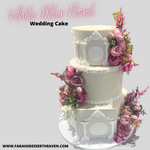 WHITE PILLAR FLORAL WEDDING CAKE