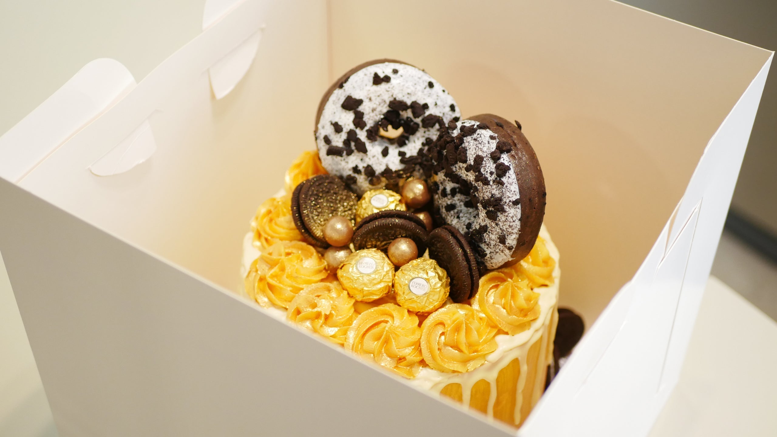 GOLD DONUT DRIP CAKE