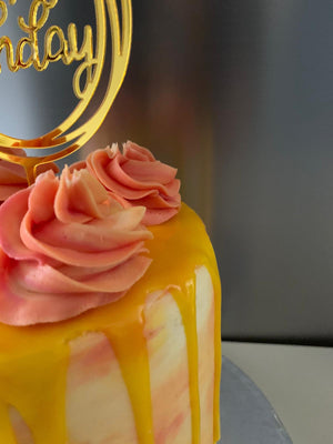 SUNSHINE AND ROSE DRIP CAKE